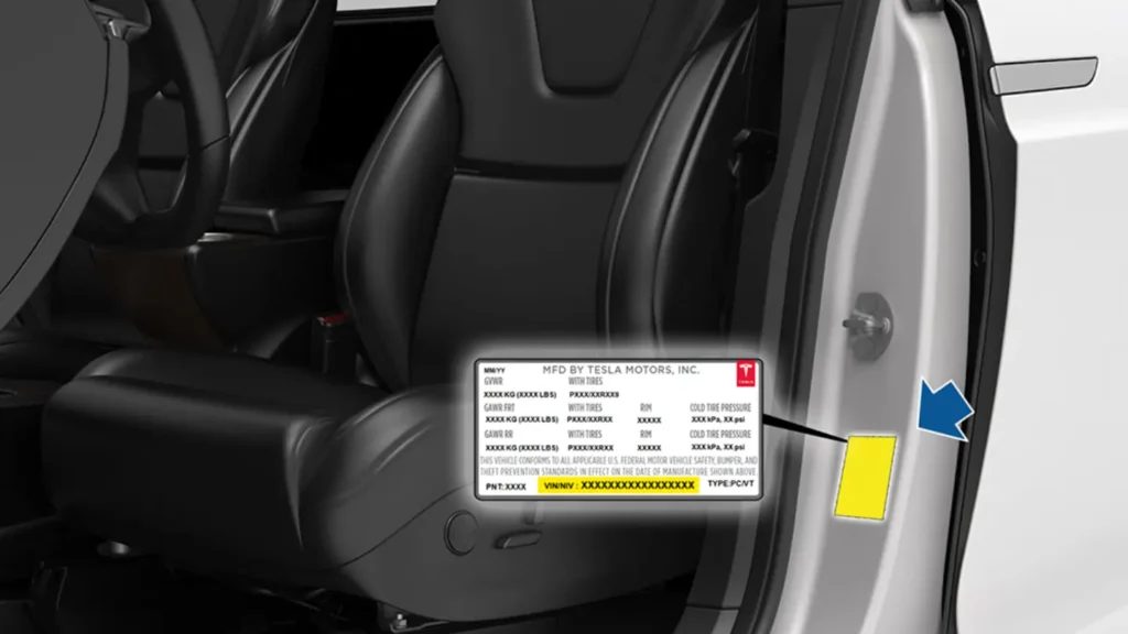 The driver's door open. A sticker on the door frame, below the latch, is enlarged; its bottom line, marked VIN, is highlighted in yellow.